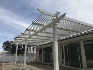 louvered top vinyl patio cover by A G Vinyl Fencing, contractors in Anaheim.